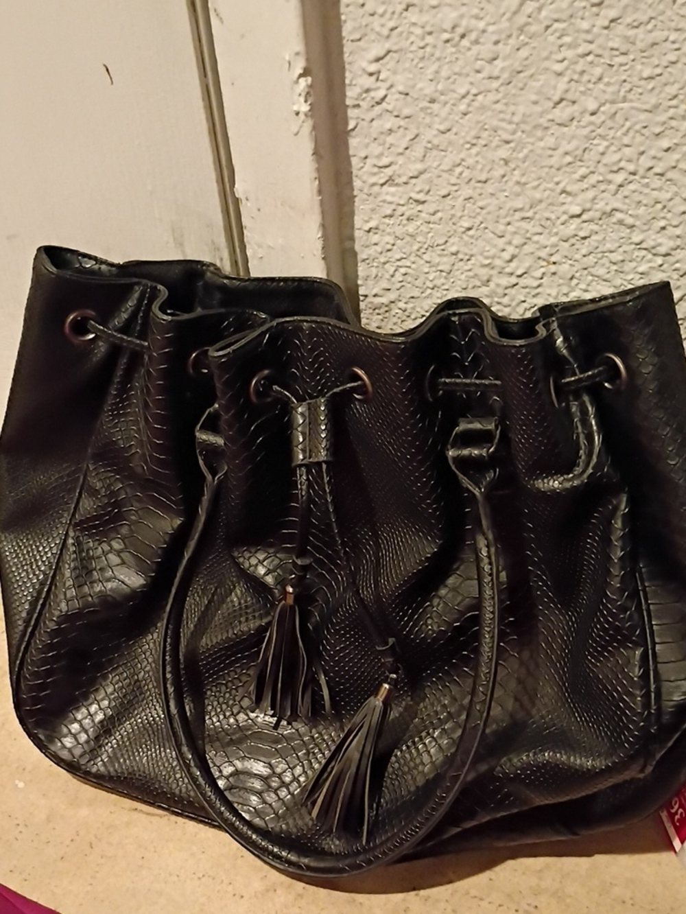 Black Faux-Snake Drawstring Hobo Bag with Tassel Accents